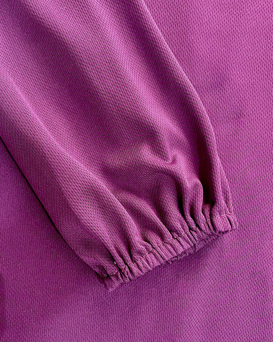 Close-up of purple dry fit purple tee with a elasticated sleeve cuffs