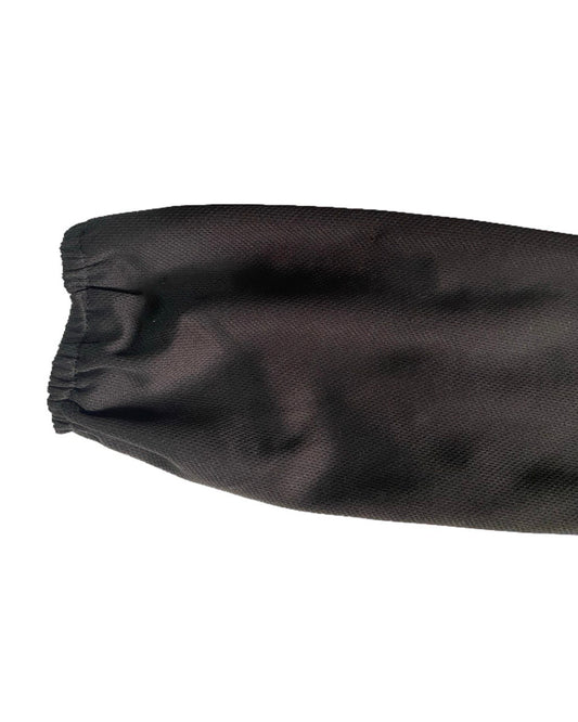 Close-up of elastic sleeve cuffs of a Black dry fit t-shirt on a white background