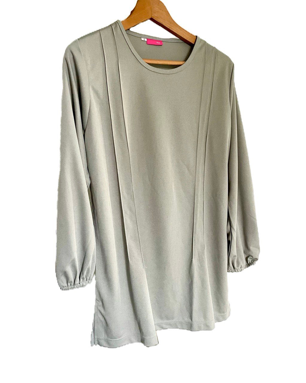 Light gray long-sleeve t-shirt on a wooden hanger against a white background