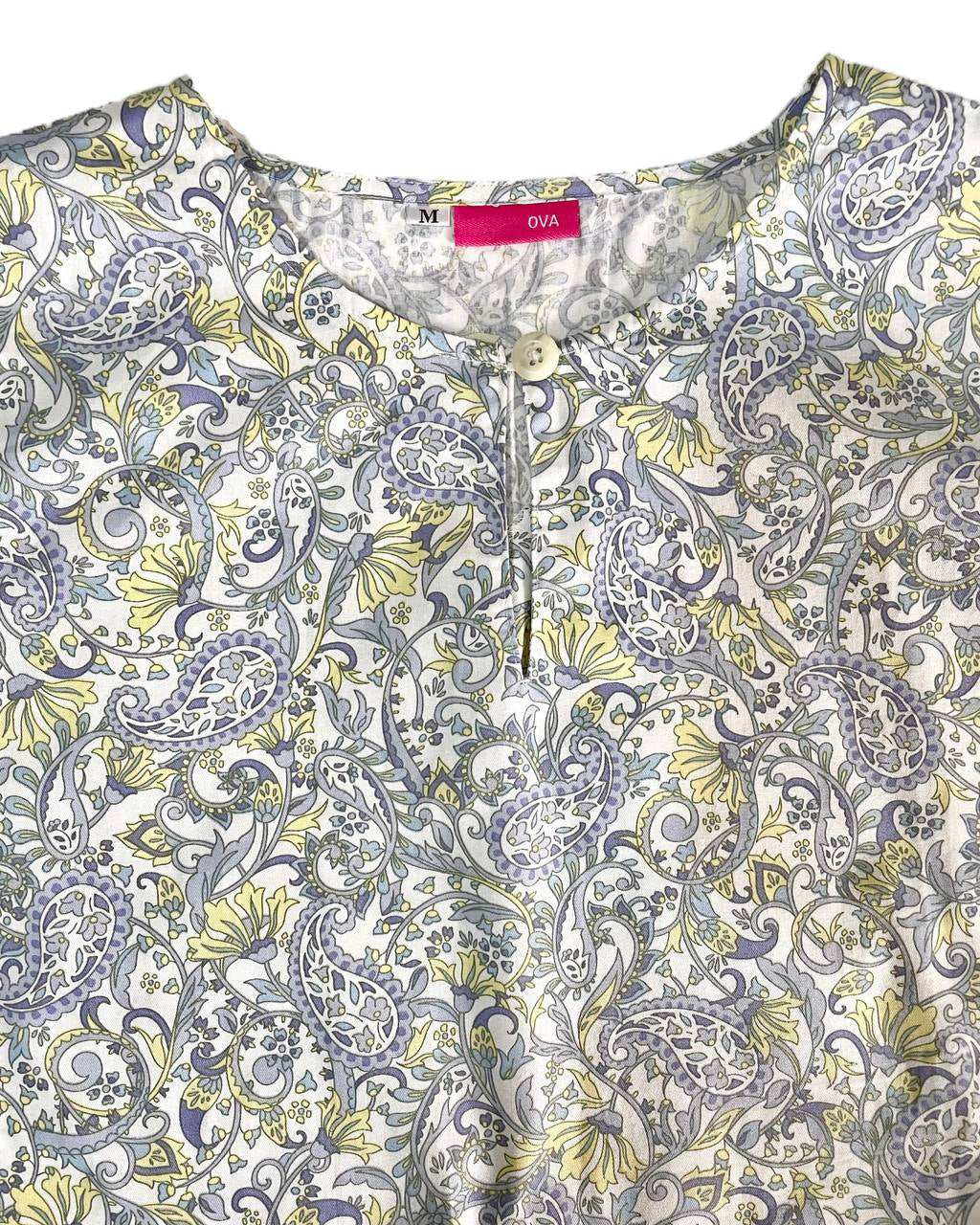 Floral shirt with a button of round neckline with a visible brand label on a white background