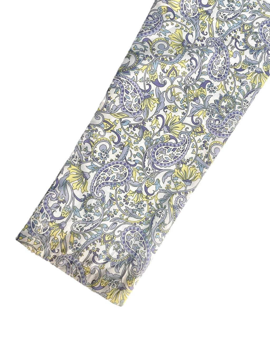 Close-up sleeve with blue and yellow floral on a white background