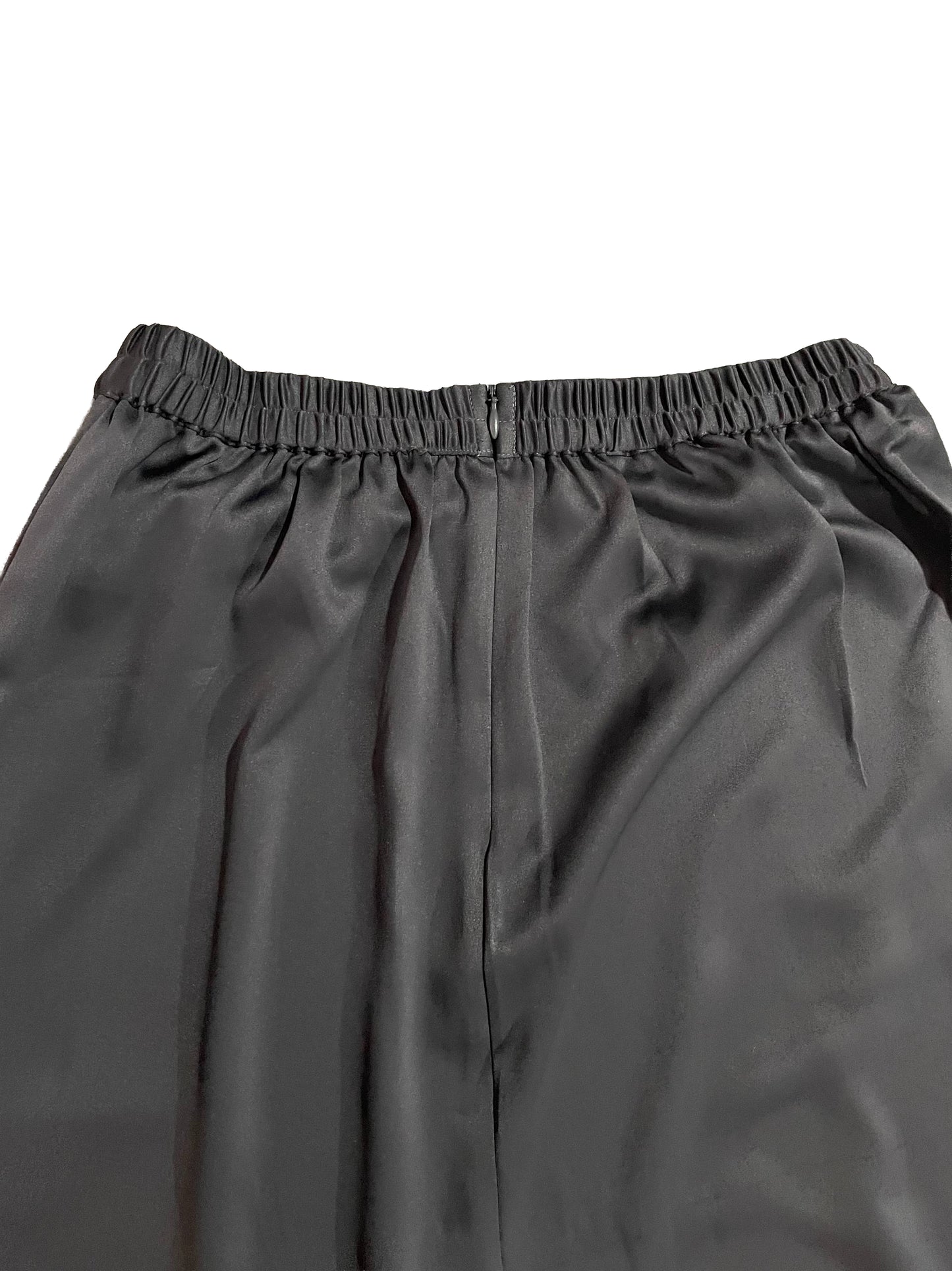 Close-up of gray skirt with an elastic waistband on a white background