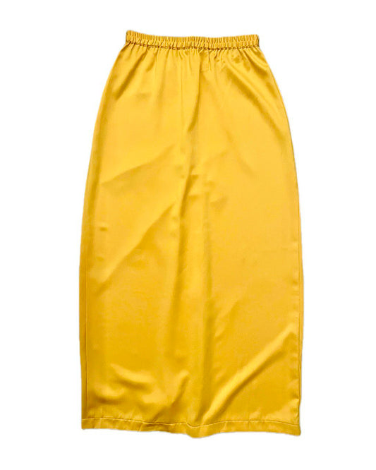 Yellow satin skirt on a white background