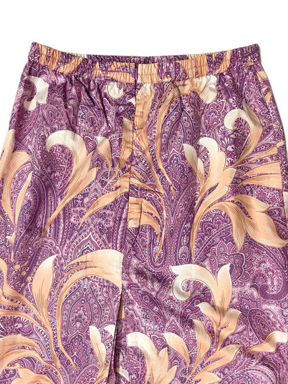 Close-up of Purple floral long blouse with beige floral pattern on a white background