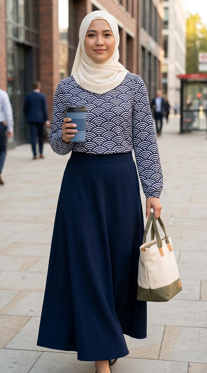 Woman holding a coffee cup and a bag on a city street
