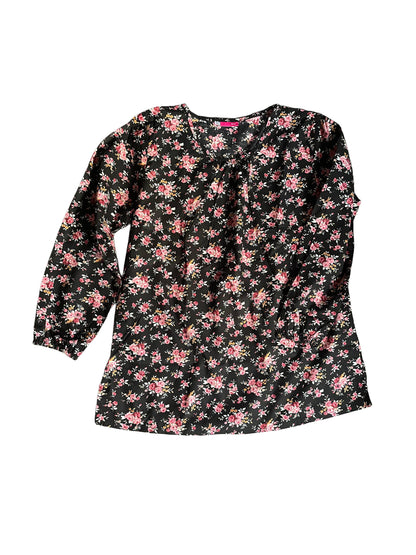 Floral patterned blouse on a white background