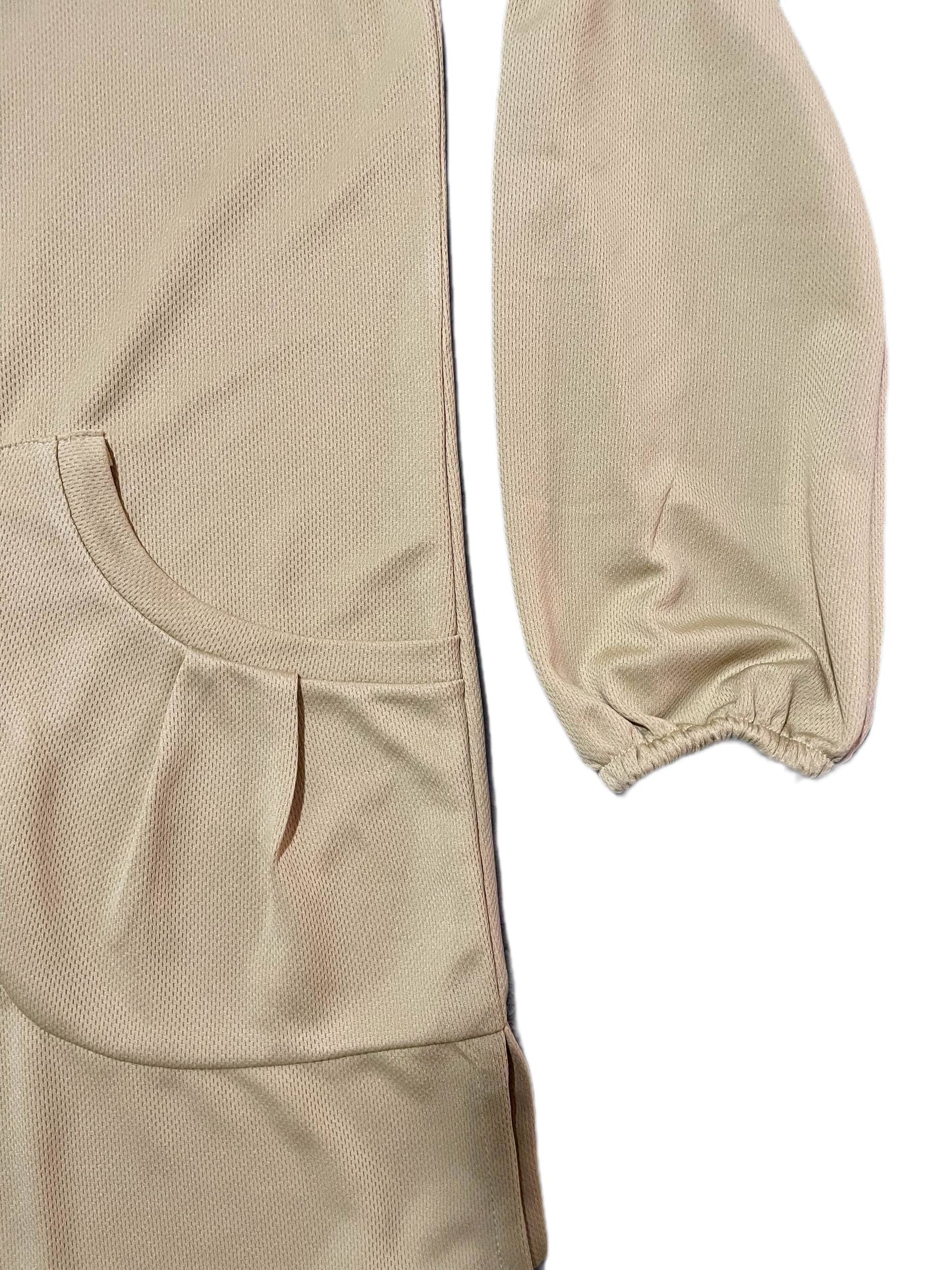 close-up of Beige dry fit tshirt with elastic cuffs sleeves and pockets on a white background