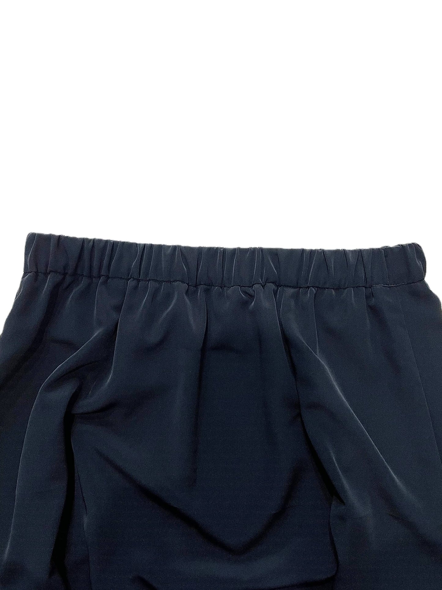 Close-up of dark navy blue fabric with an elastic waistband, shown against a plain white background.