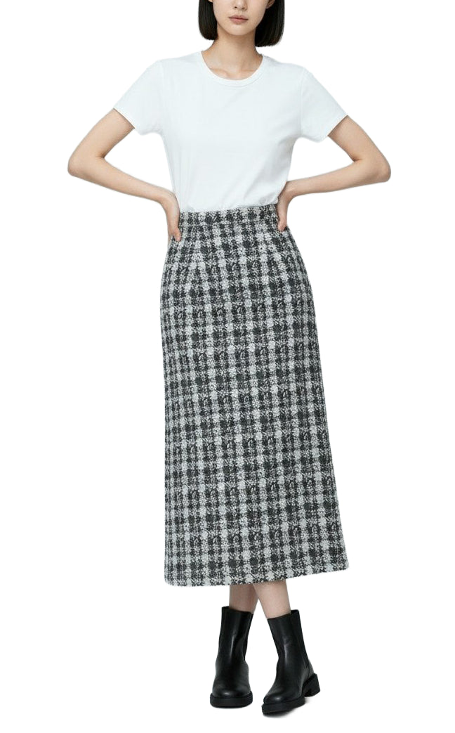 Person wearing a white t-shirt and plaid skirt on a white background