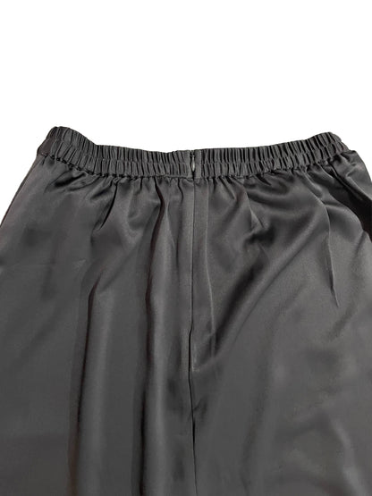 Close-up of gray skirt with an elastic waistband on a white background