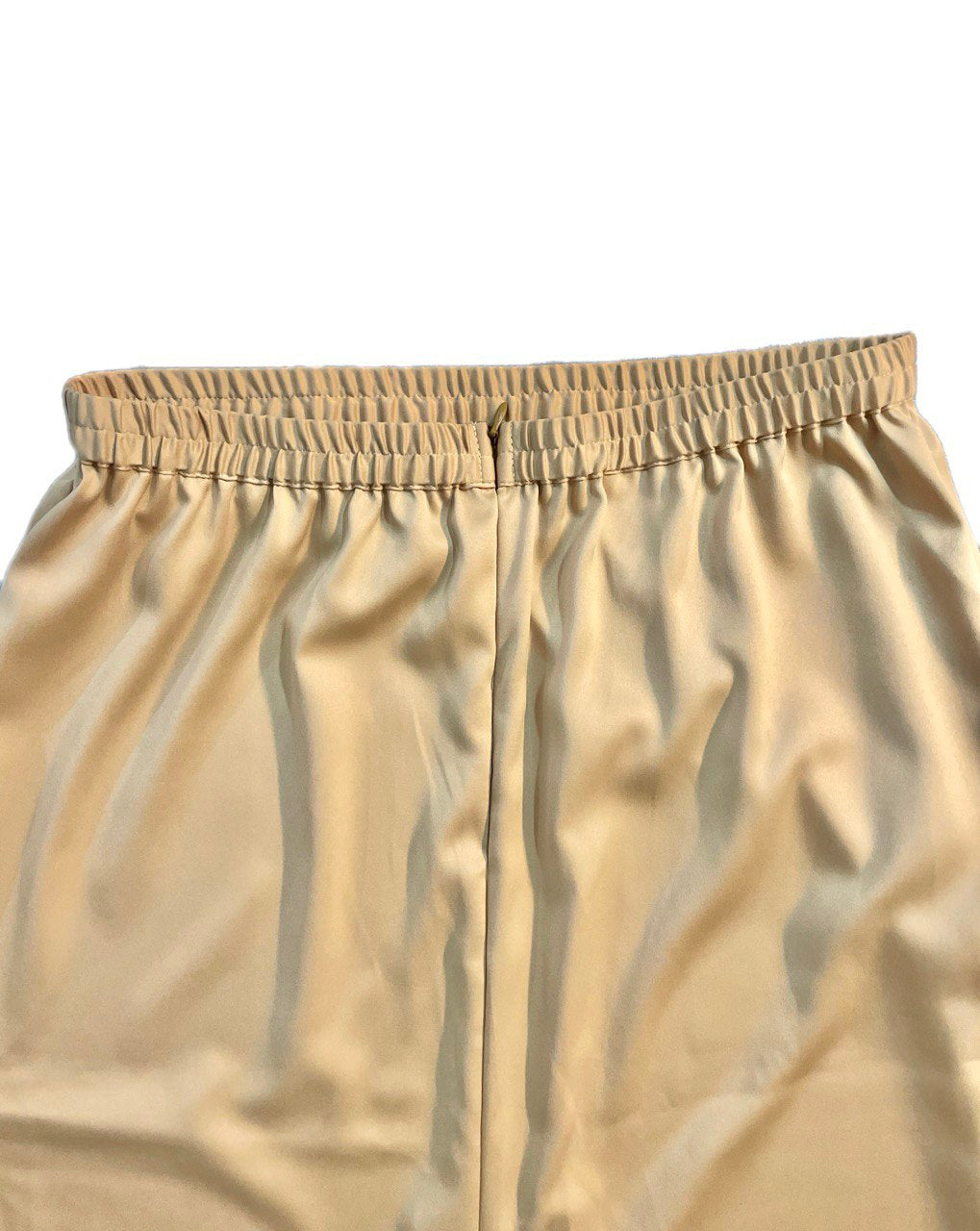 Close-up of back skirt brown with an elastic waistband on a white background